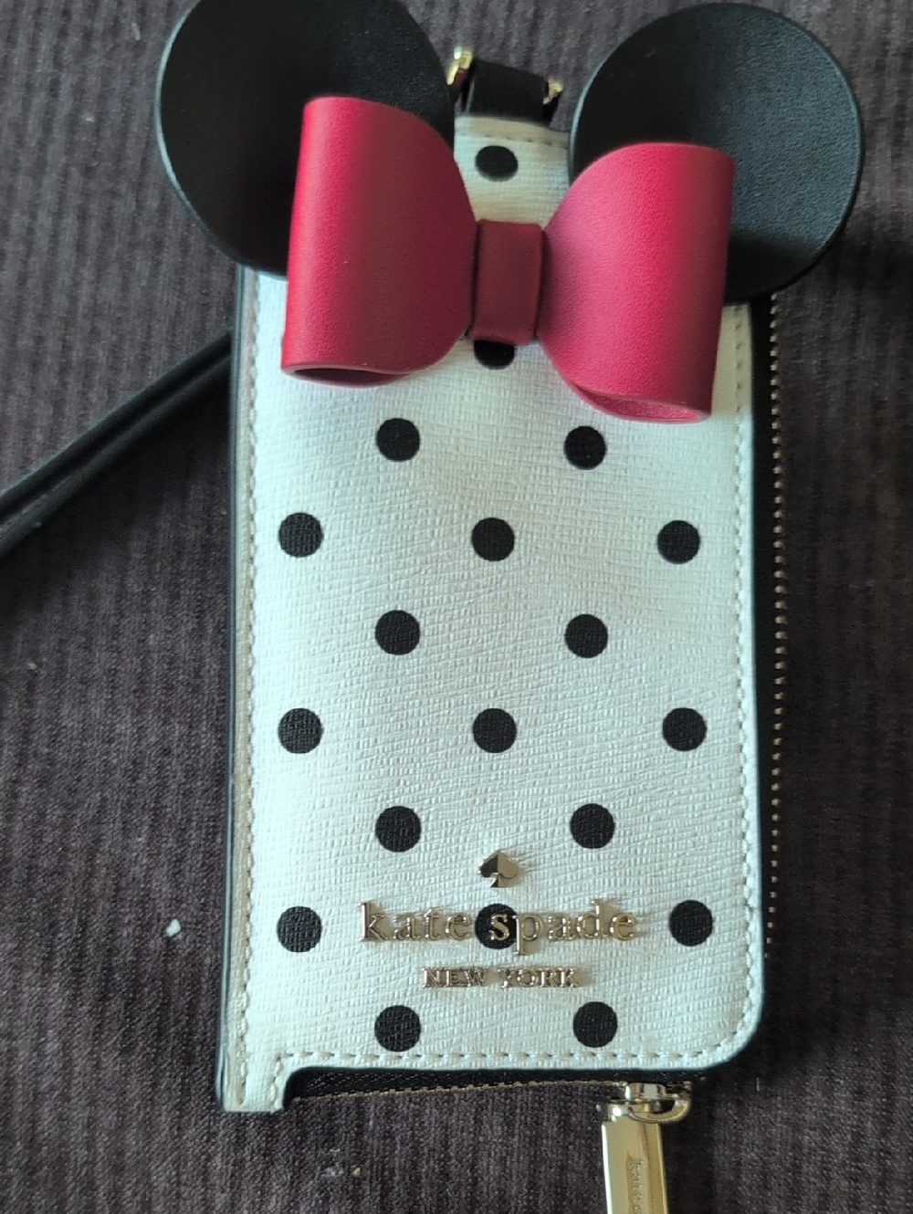 kate spade white polka dot wristlet with black ears and pink bow